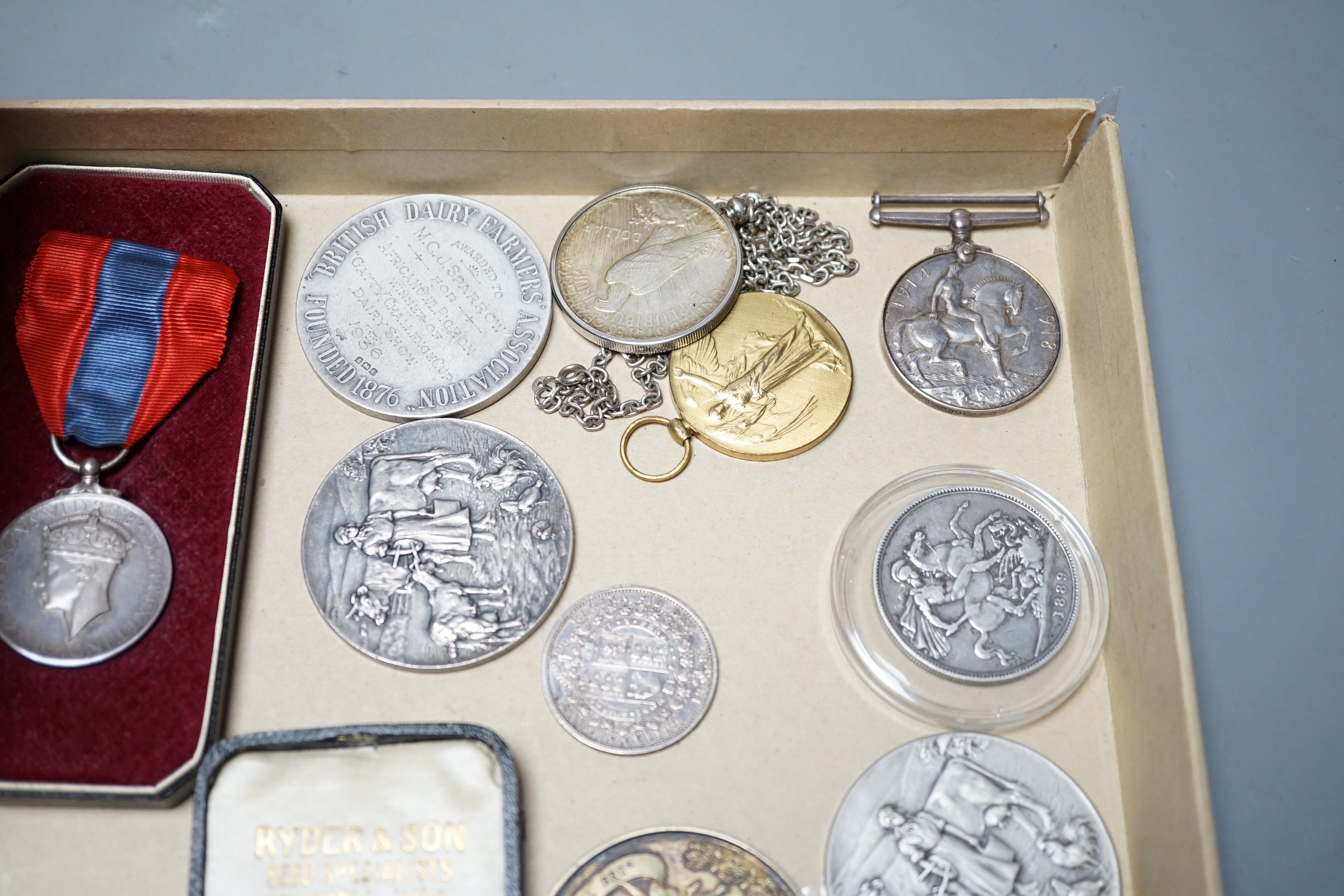 A group of silver commemorative medals, a Victoria 1889 crown, 1880 halfcrown, two cased ISM and to WW1 medals